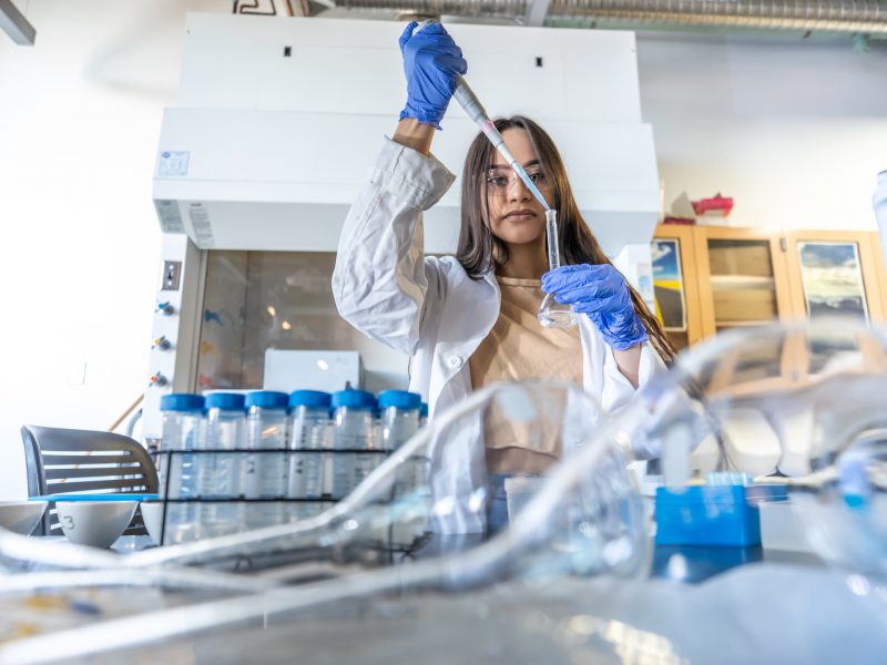 Student working a research lab.