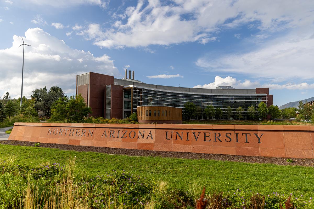 West campus entrance with the the NAU wall sign in front of the Applied Research and Development building.