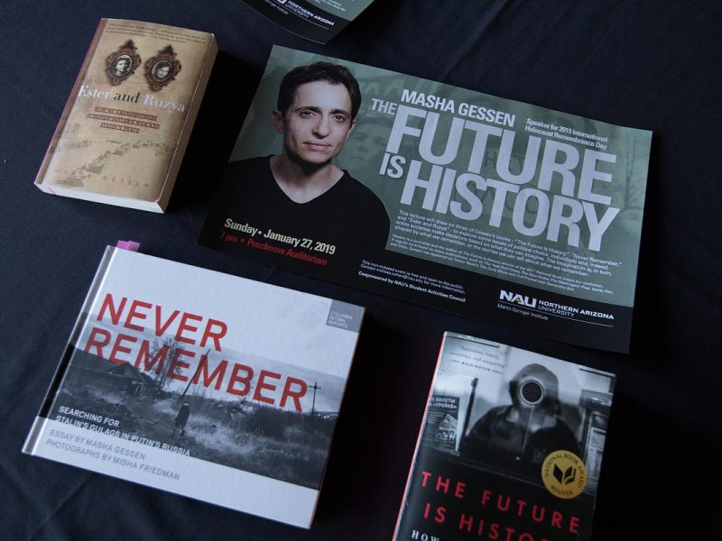 Book covers, book titles, and a poster. The book covers feature text and graphic elements. The poster contains a portrait of a person along with a title and text.
