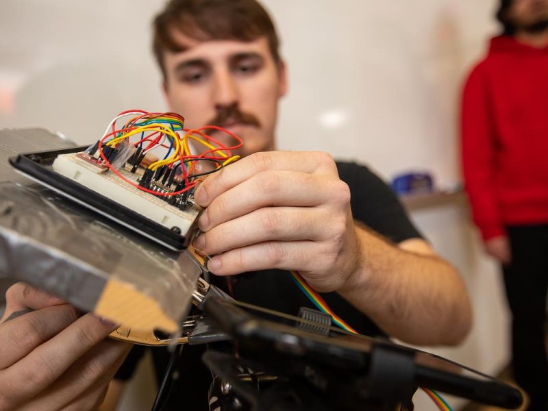 Electric computer component with different colored wires that is on an electric bike.
