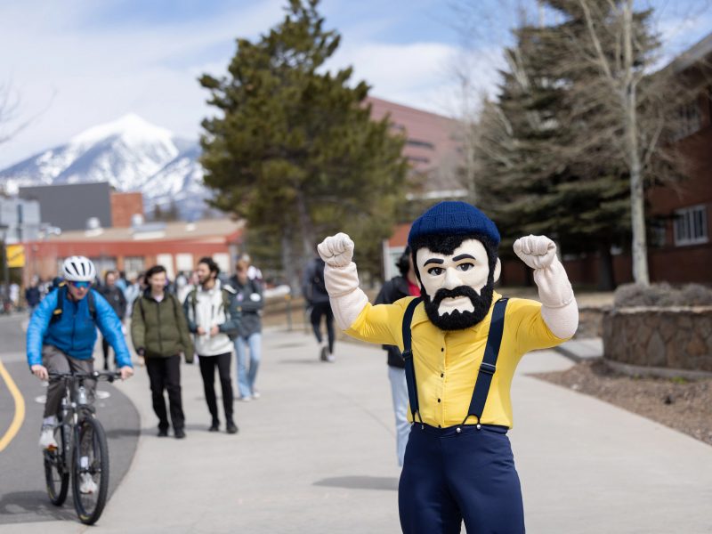 N A U Lumberjack posing for the camera on Flagstaff campus.
