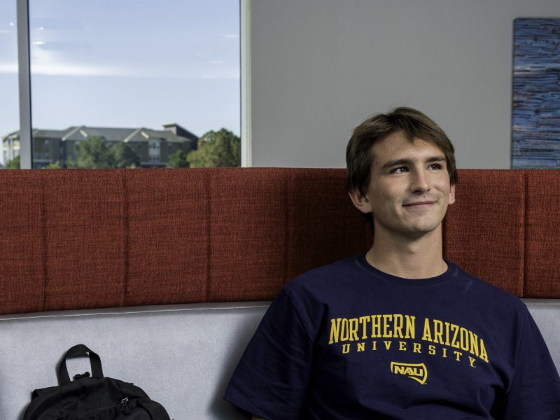 Student sitting in Honors Dorm at N A U.