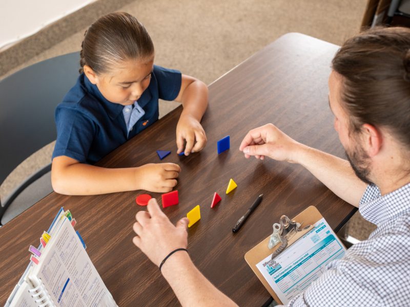 N A U counselor working with young student.