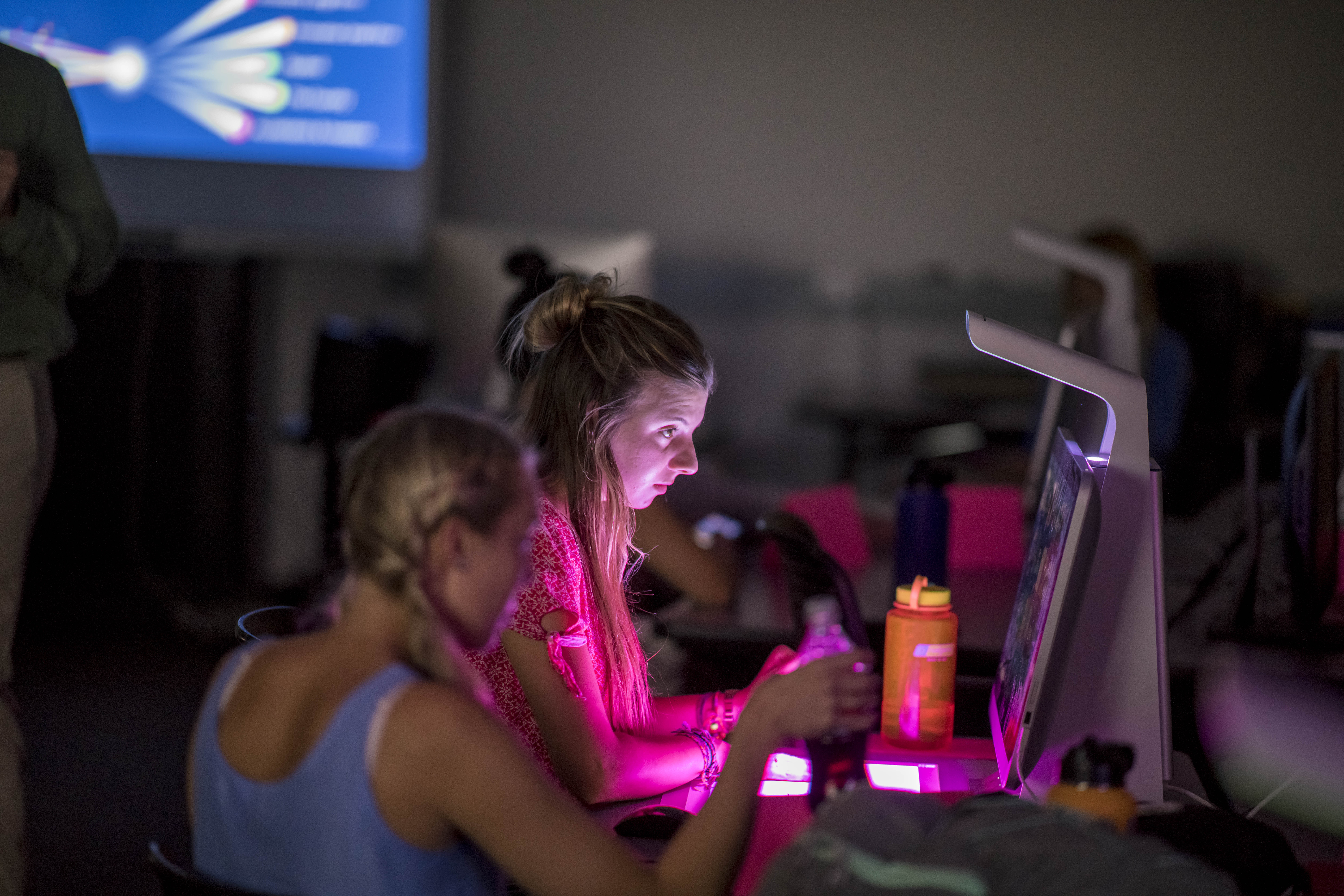Students working on desktop computers.