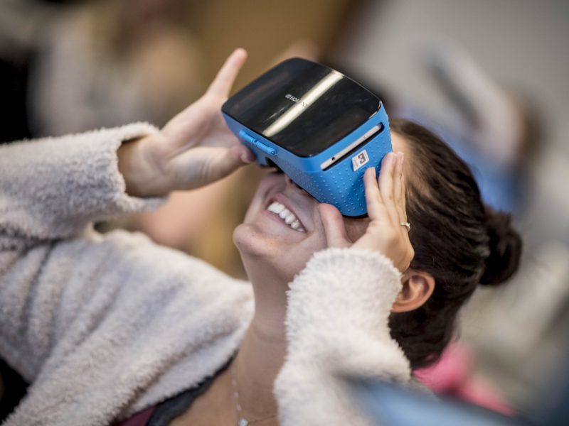 N A U student looks into V R goggles.