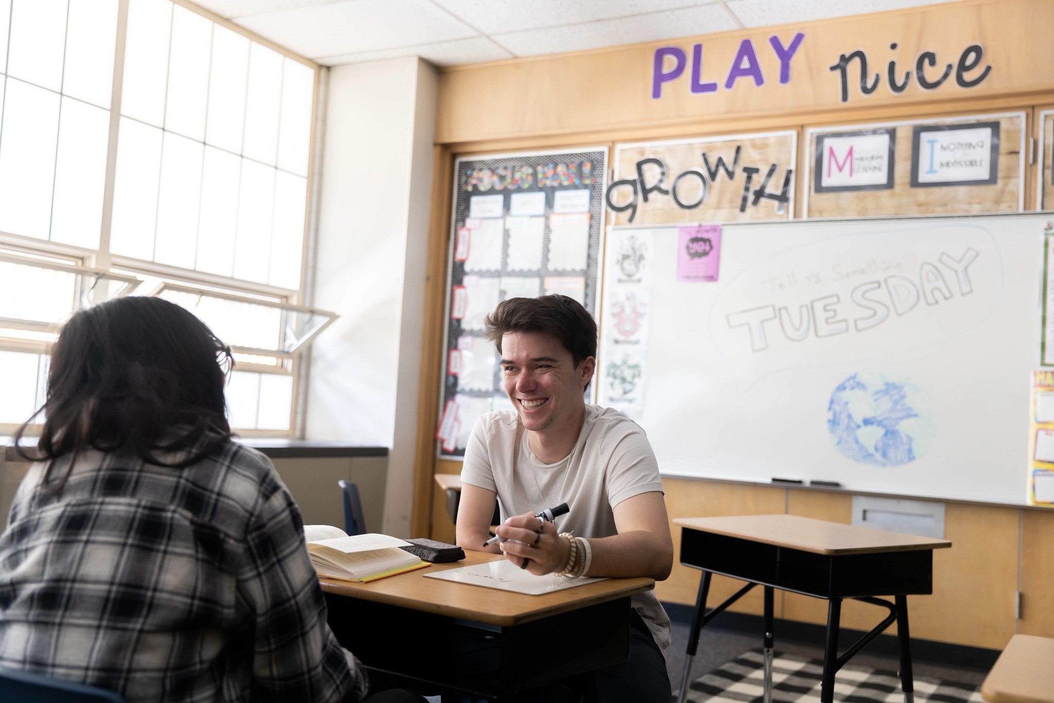 Two N A U students sitting at a desk working together.