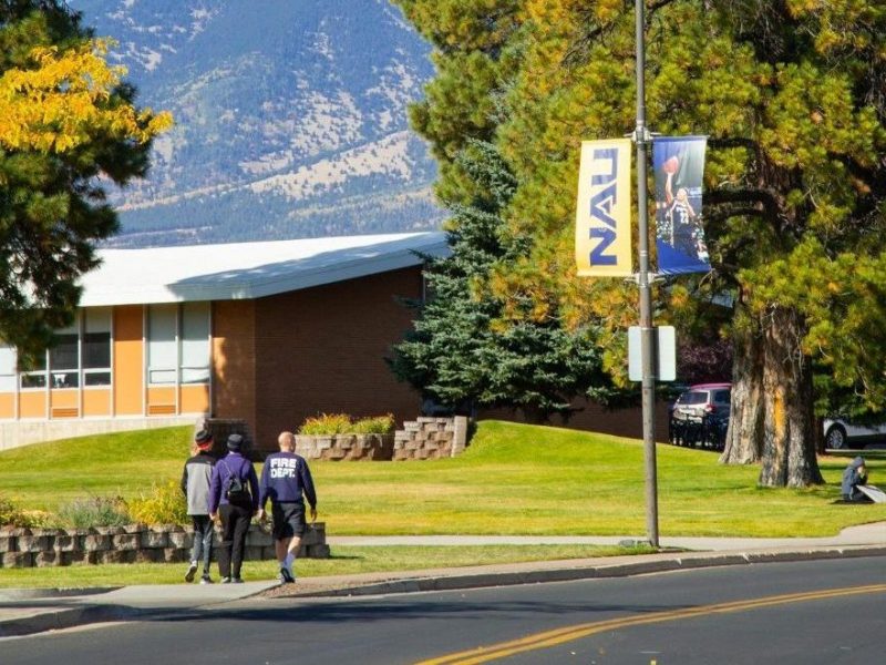N A U students walking on campus.
