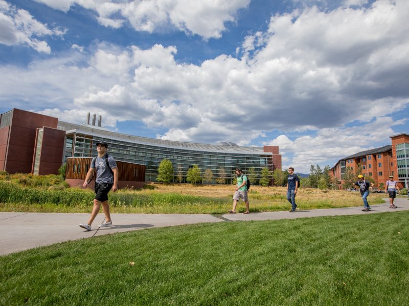N A U students walking on campus.