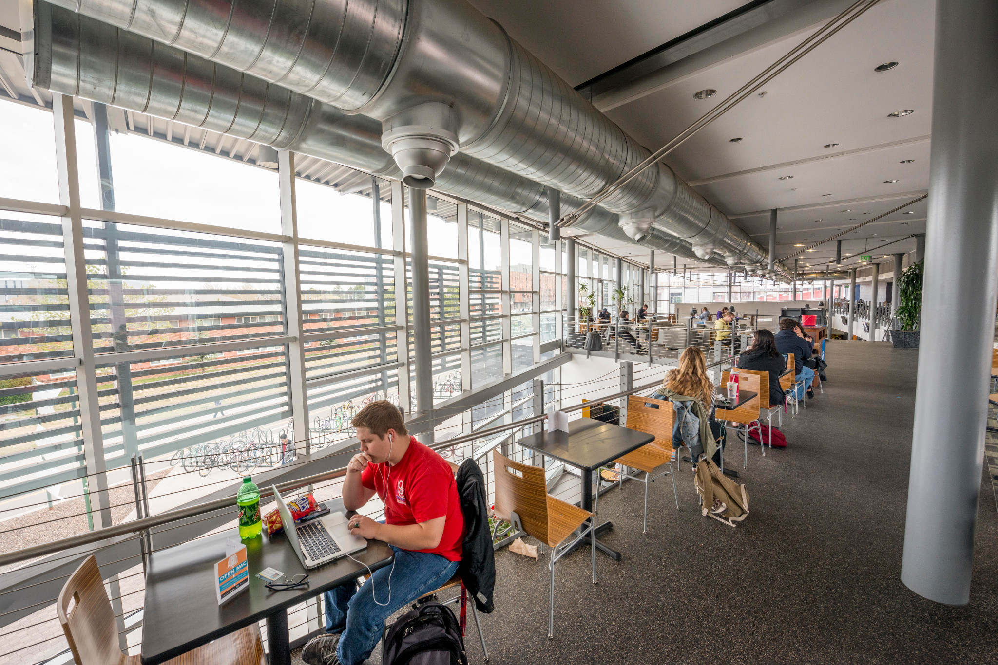 N A U students sitting at tables in the Student Union.