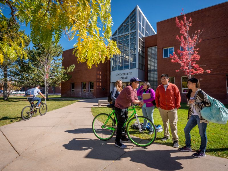 N A U students hanging outside of University Union talking.