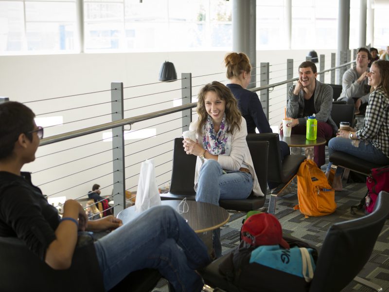 Students sitting at tables in the Student Union.