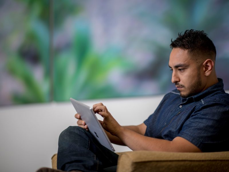 N A U student working on tablet.