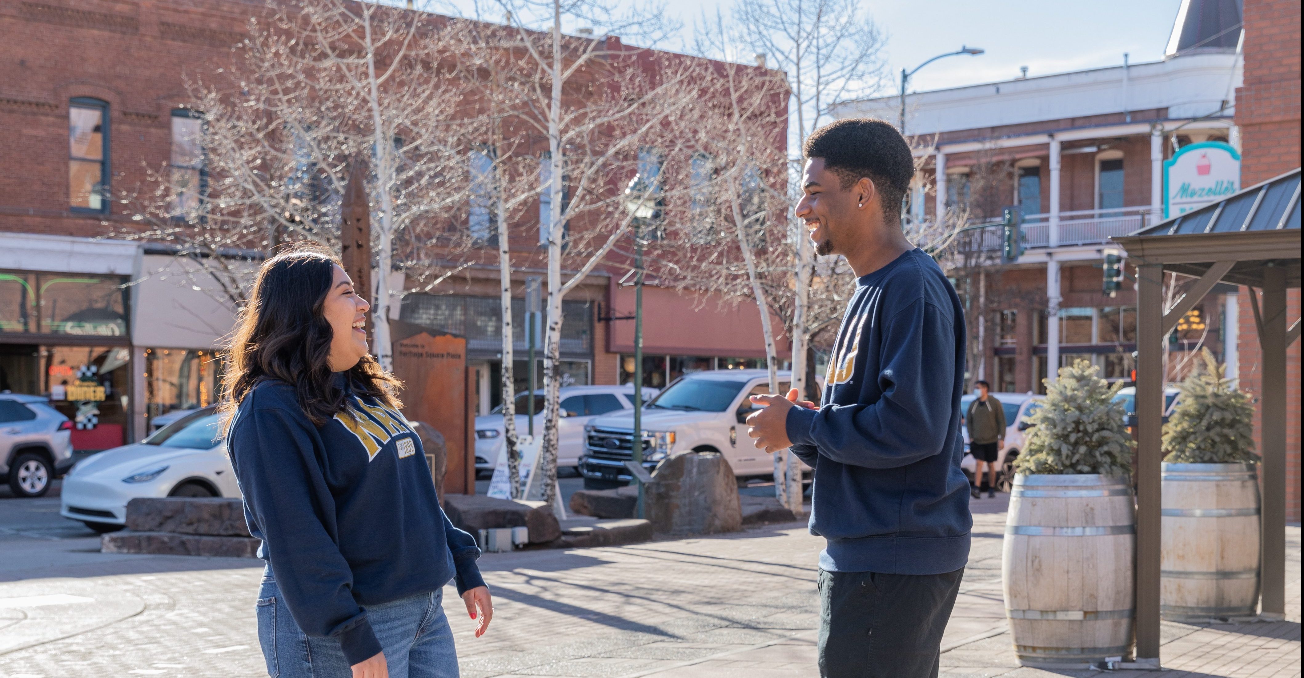 N A U students laughing in downtown Flagstaff.