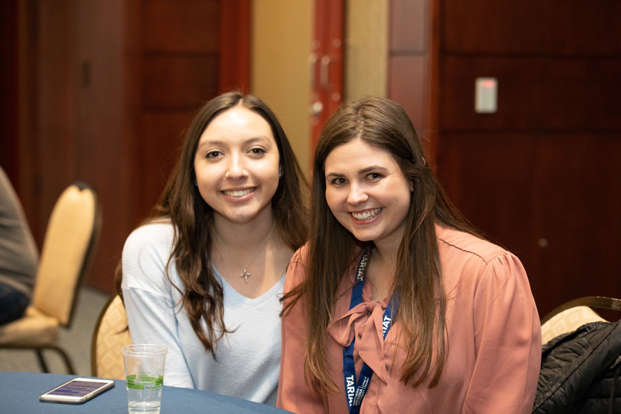 N A U students smiling at a banquet.