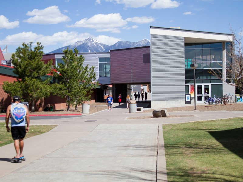 N A U students walking on campus.