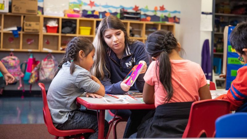 Student of N A U's College of Education teaching children.
