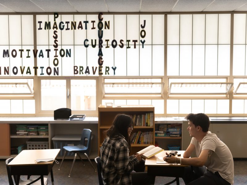 Faculty speaking to student.