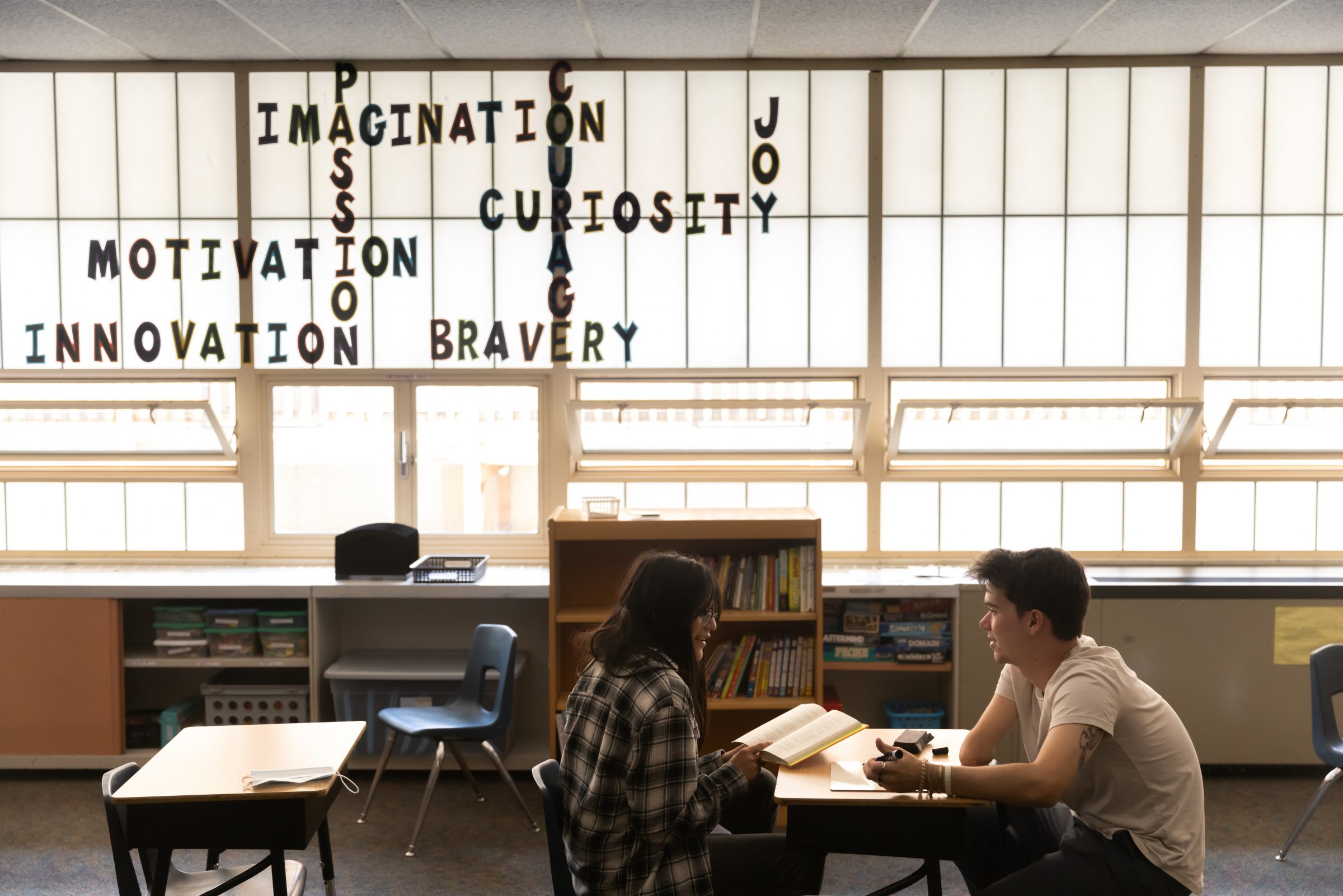 Faculty speaking to student.