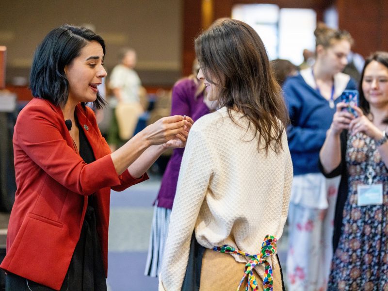 People talking at There is a Reason I am a Teacher conference.