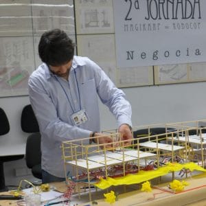An NAU professor is working with a building model of small scale