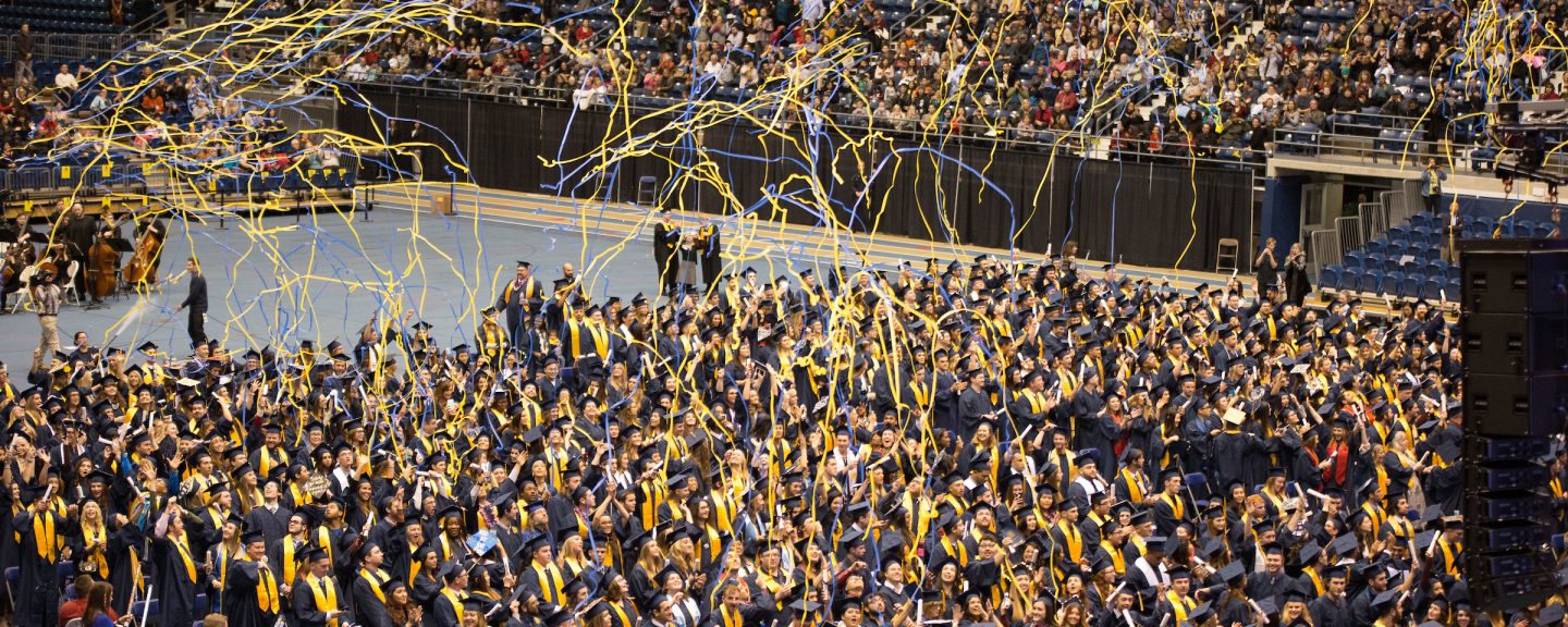 N A U students celebrate at graduation.