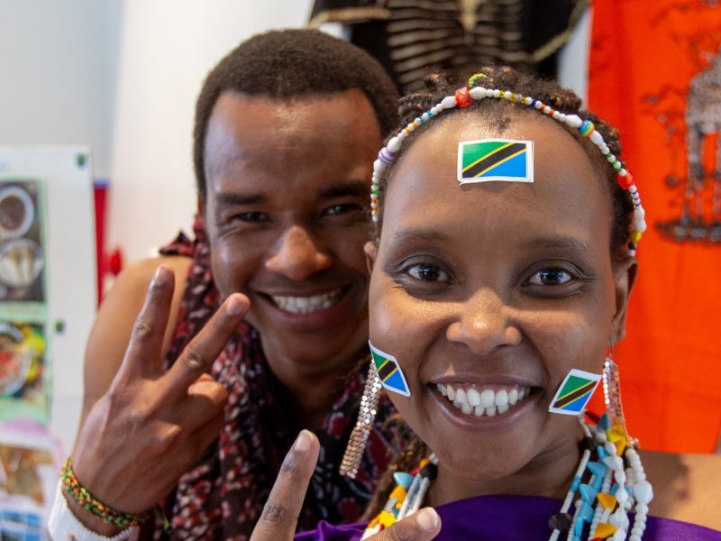 Students smiling while showing peace signs.