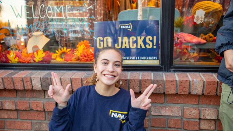 A female student holing up her LJs downtown.