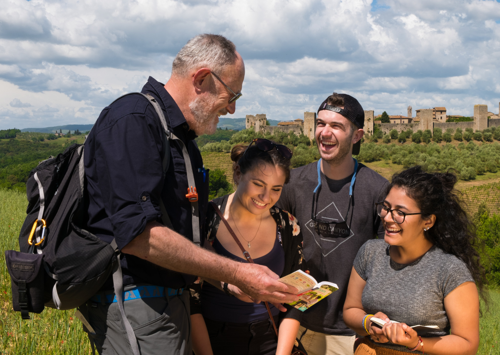 Students talking to their tour guide in Italy.