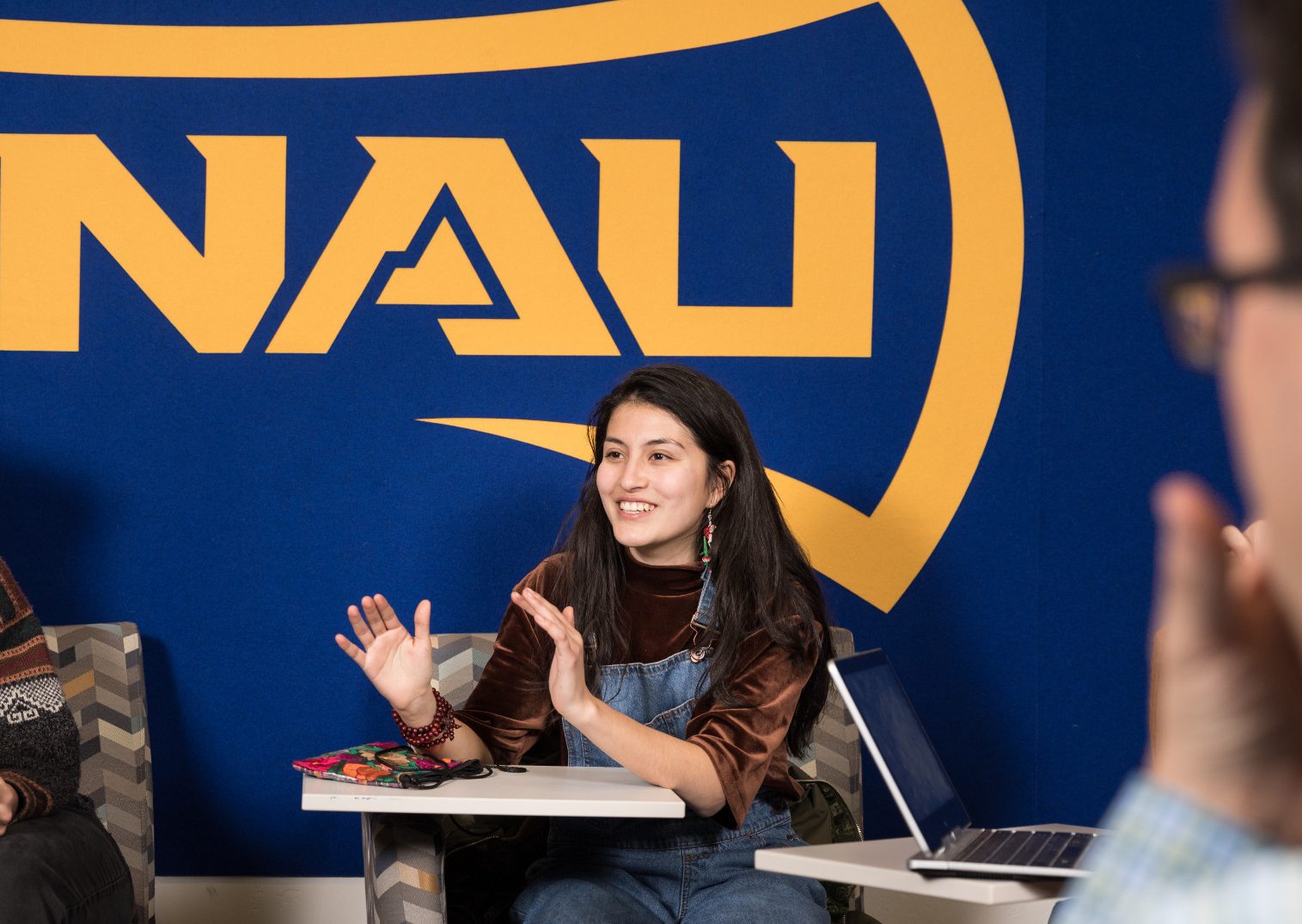 N A U students working together in a classroom.