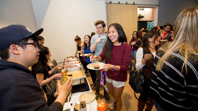 Students trying different types of international cuisines.