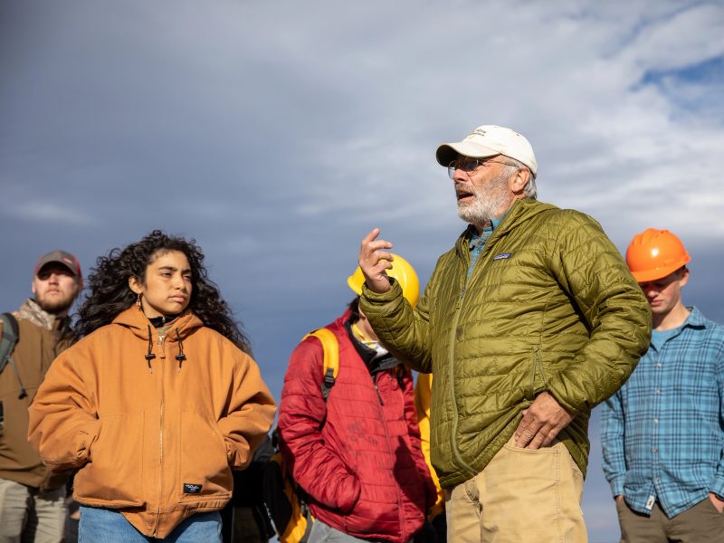 A faculty member with students outside