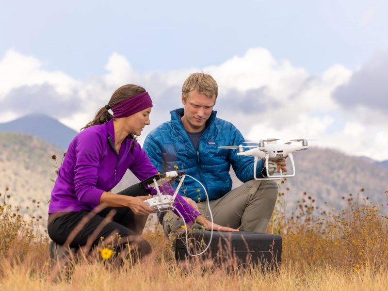 Logan Berner and another person in a empty field.