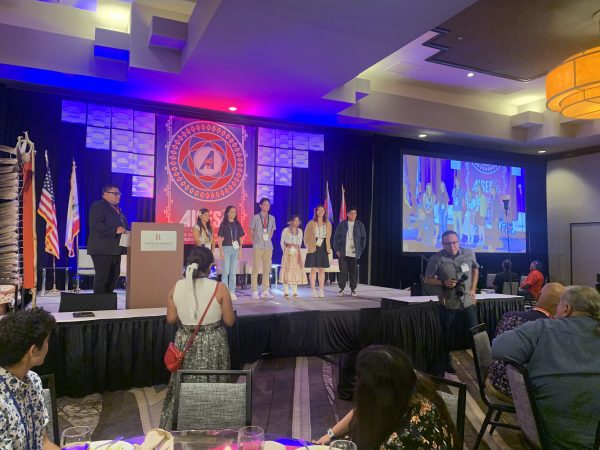 Amber and Izzy receiving their Boeing award.