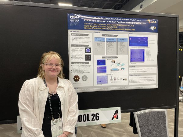 Sammy and their poster presentation.