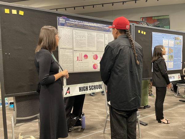 Kayla and their poster presentation.