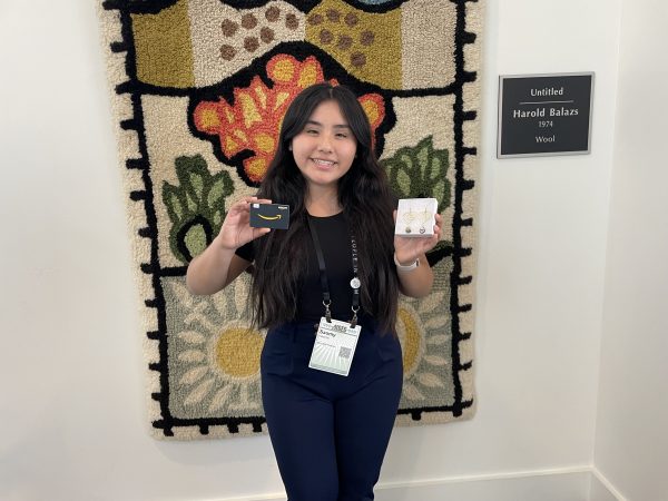 CARE Student, Saomy, winning a raffle.