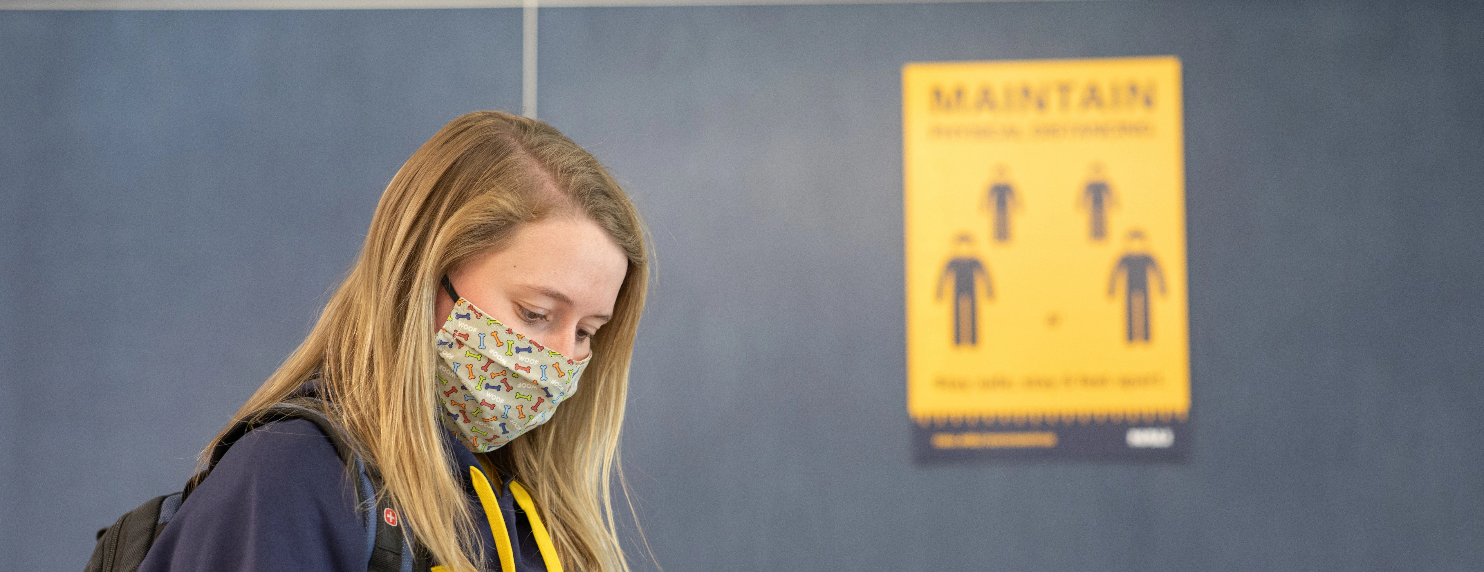 Student wears a mask on campus.
