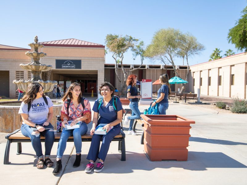 Students sitting together outside.