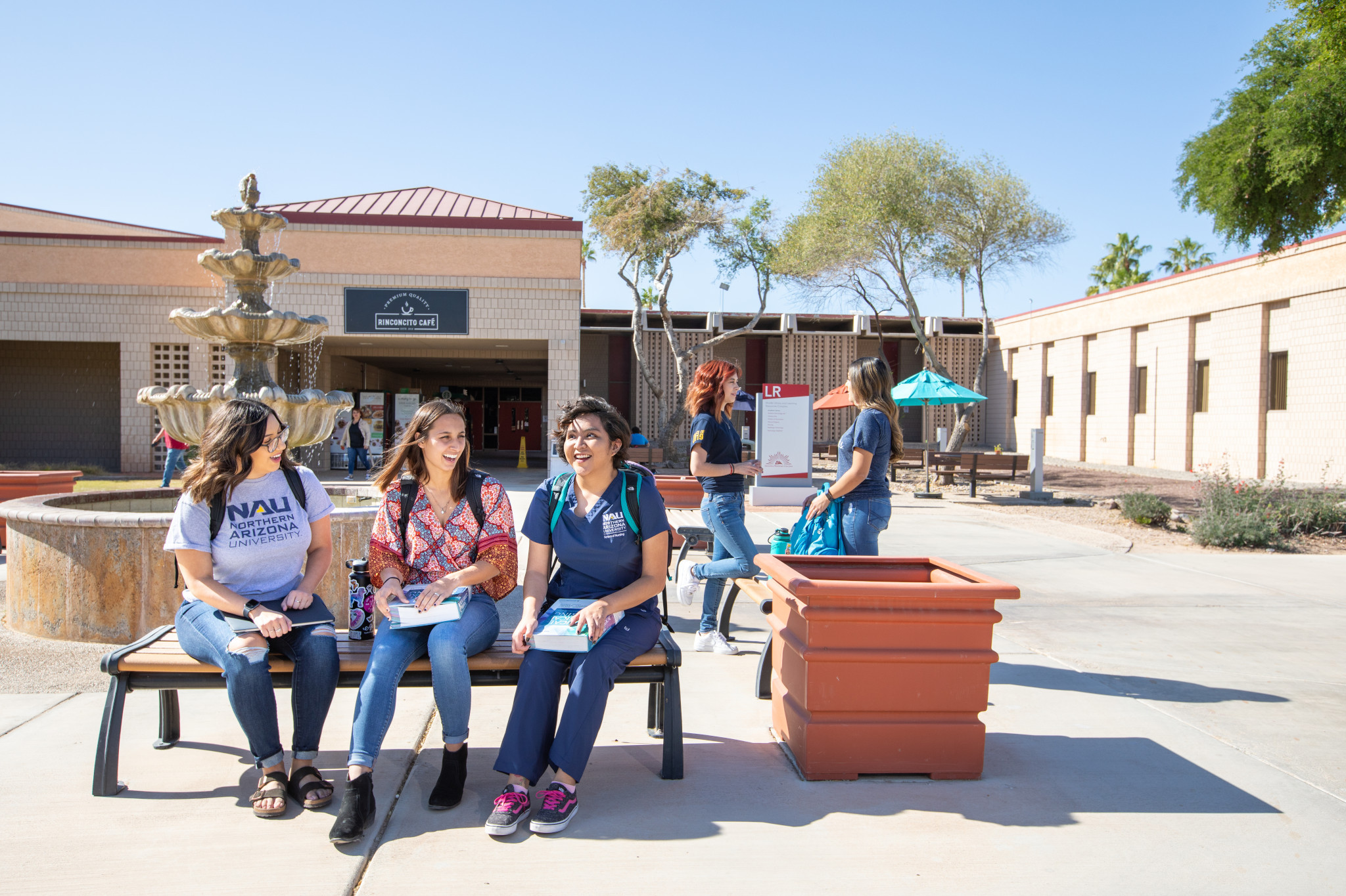 Students sitting together outside.