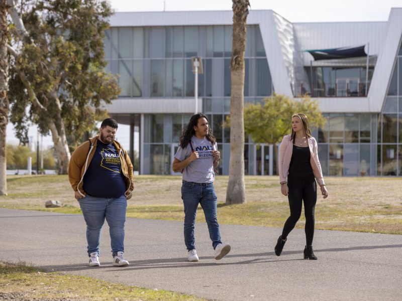Students walking on N A U–Yuma campus.