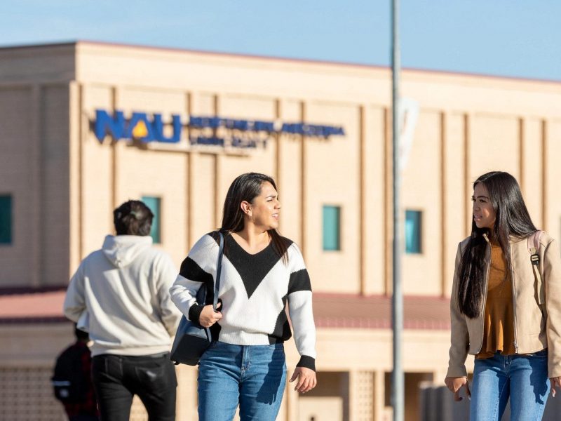 N A U&ndash;Yuma students walking on campus.