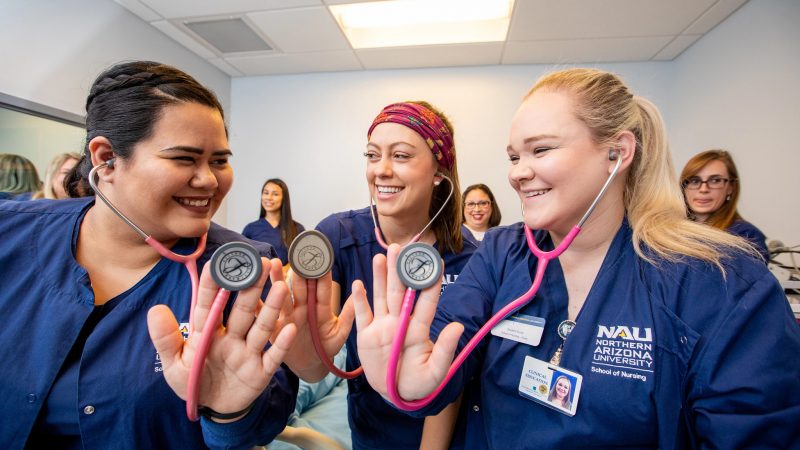 N A U nursing students posing for a photo.