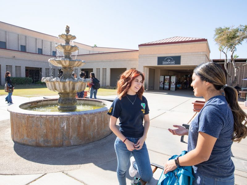 N A U&ndash;Yuma students near water fountain.