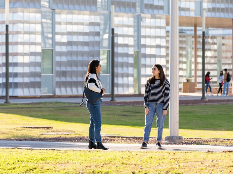 N A U–Yuma students standing outside.