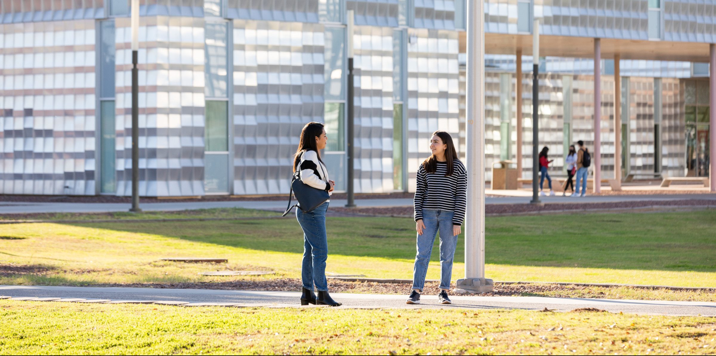 N A U–Yuma students standing outside.