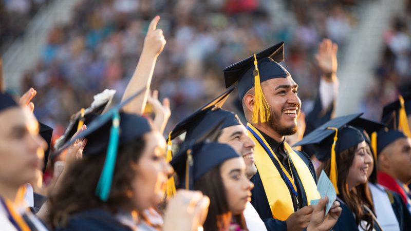 Students smile at N A U&ndash;Yuma commencement.