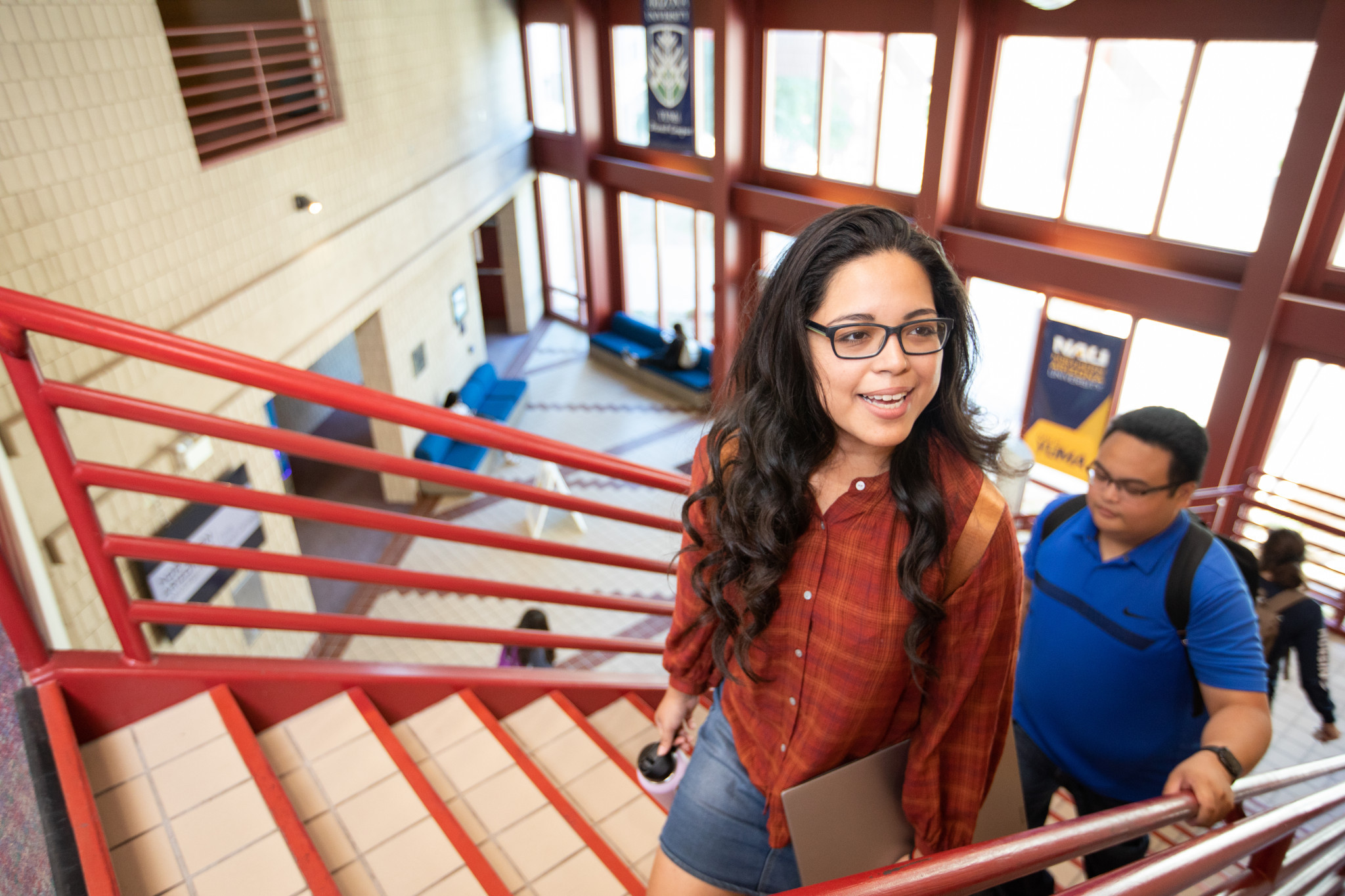 N A U&ndash;Yuma students walking up the stairs.
