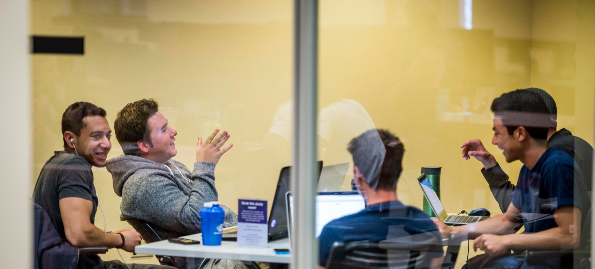 N A U students working in a study room at Cline Library at N A U.