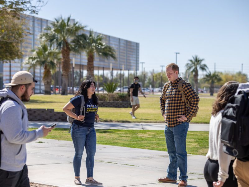 Group of students outside on N A U&ndash;Yuma campus.
