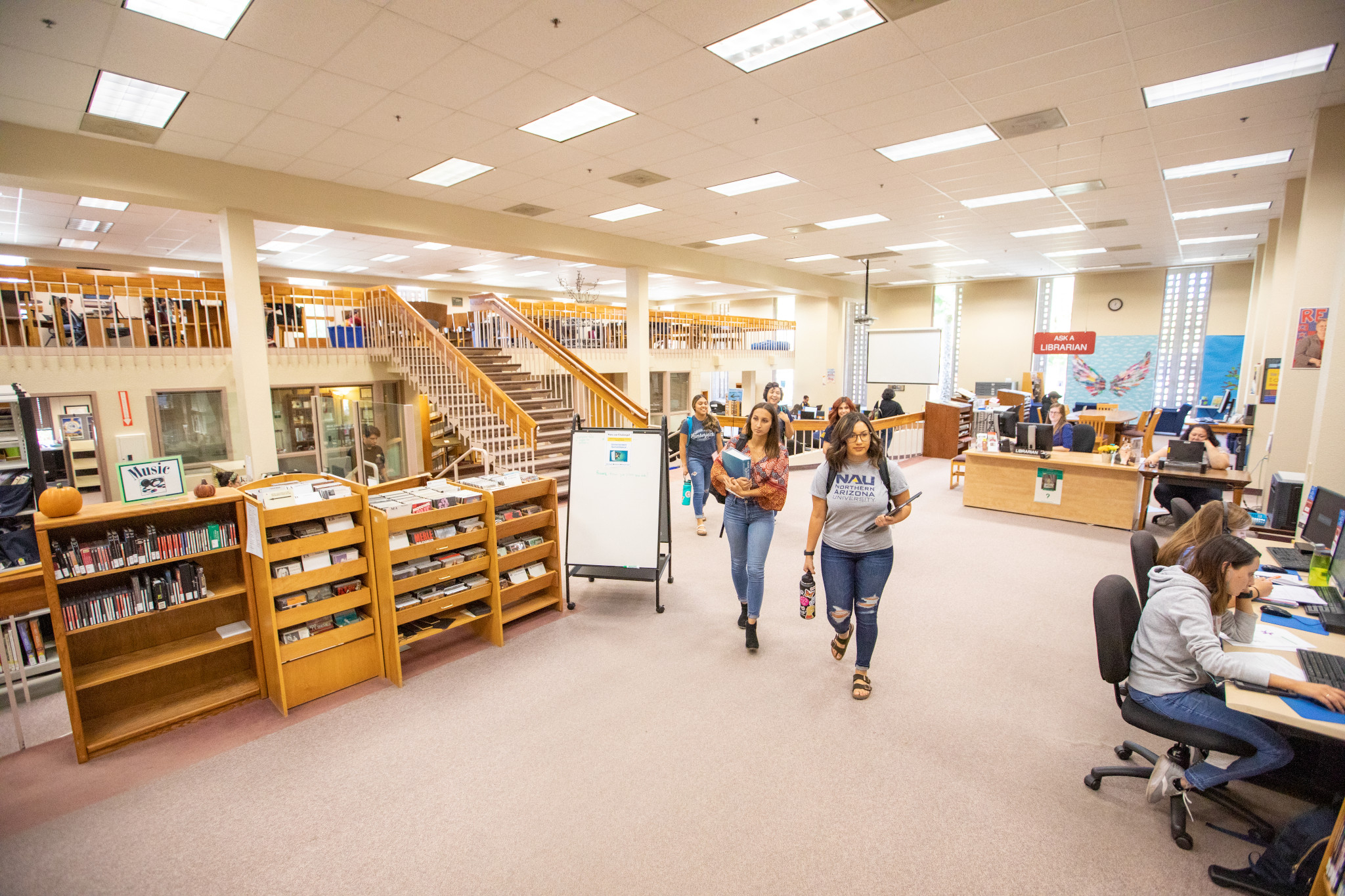 Students walking in the library at N A U&ndash;Yuma.